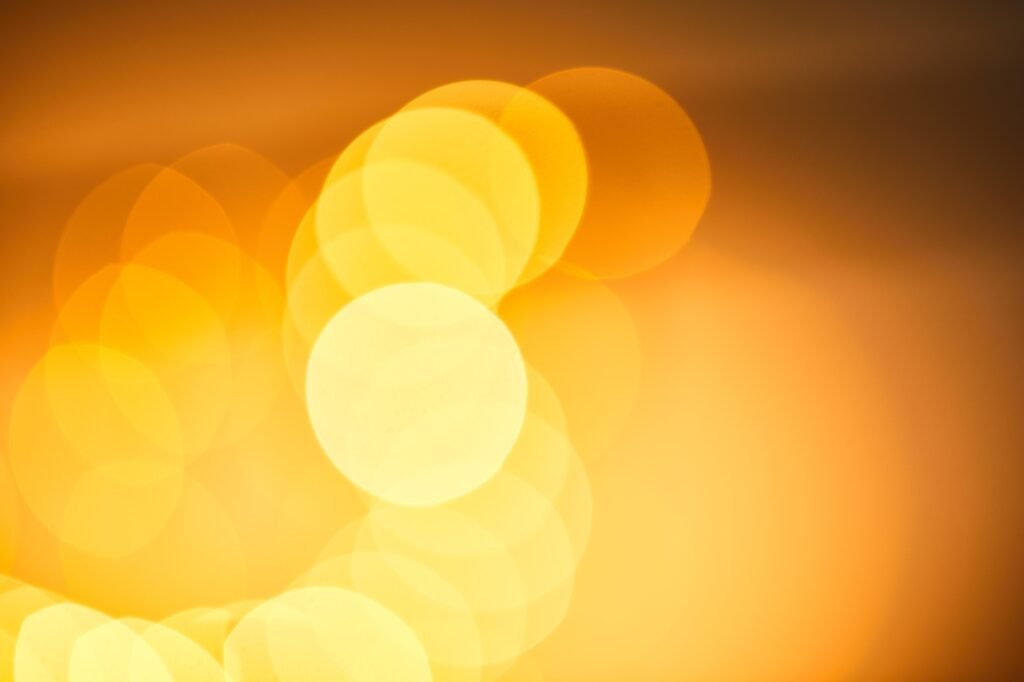 Festive blurred background, bokeh of yellow christmas lights