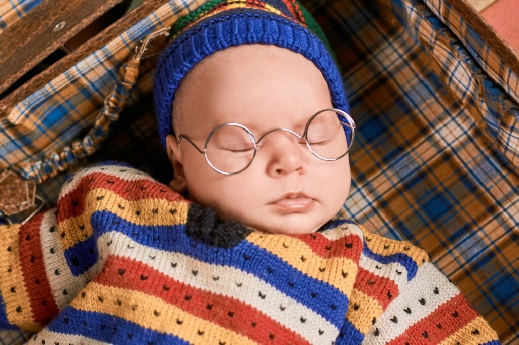 Baby in spectacles sleeping