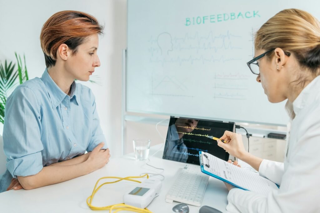 Biofeedback Training. Biofeedback Practitioner and Patient in Consultation