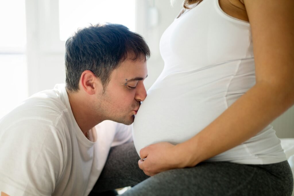 Happy pregnant woman relaxing with her husband
