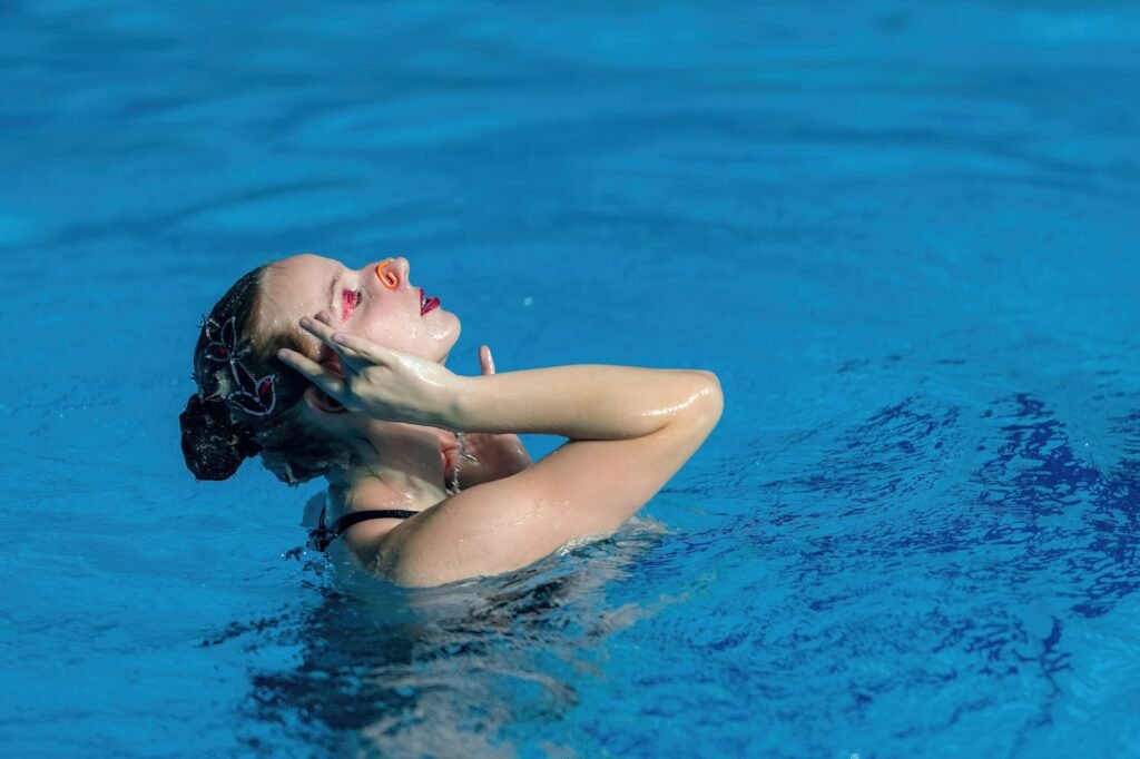 Solo synchronized swimming performance, blending grace and precision in aquatic artistry