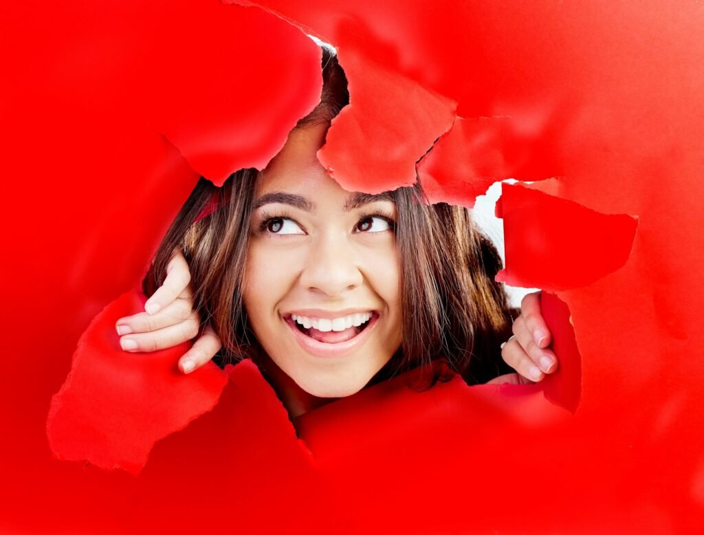 Thinking, breaking wall and woman with ideas, surprise and breakthrough with happiness, excited and