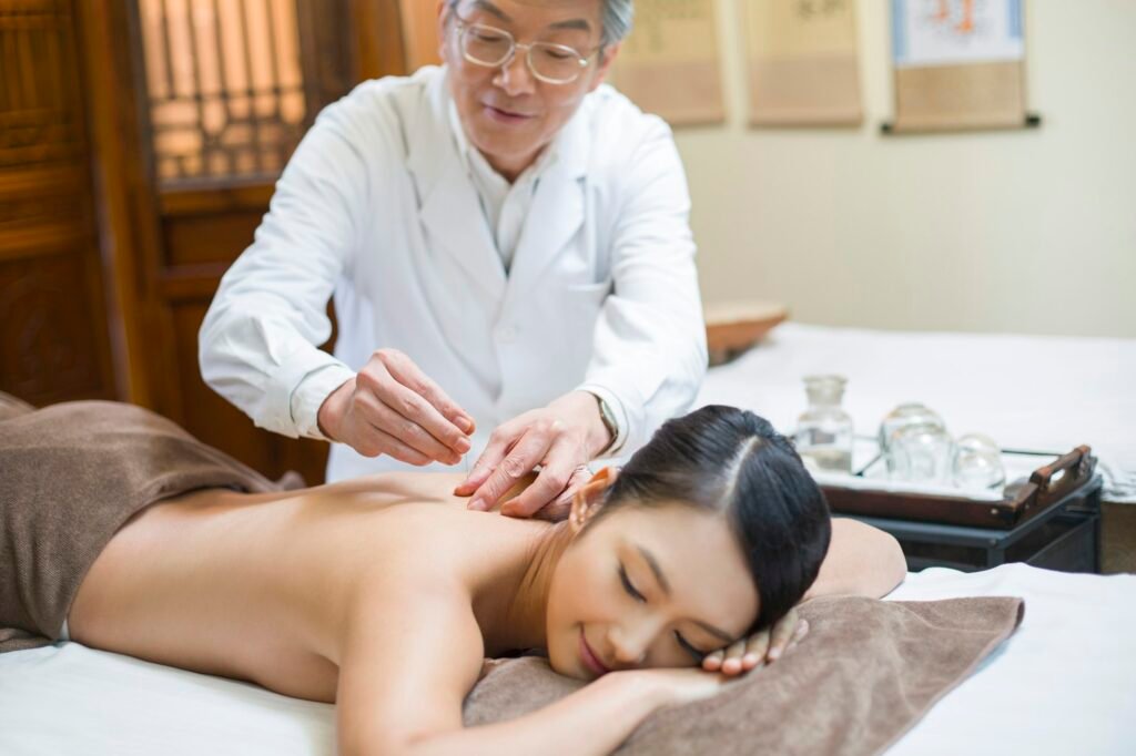 Young woman receiving acupuncture