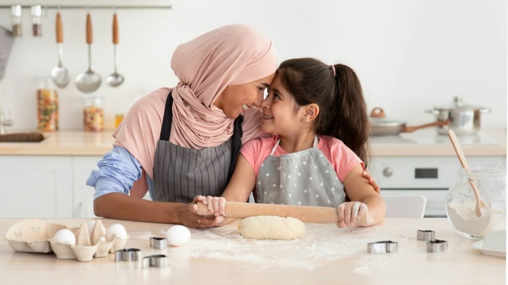 Arabic Family Mom And Child Bonding While Baking In Kitchen