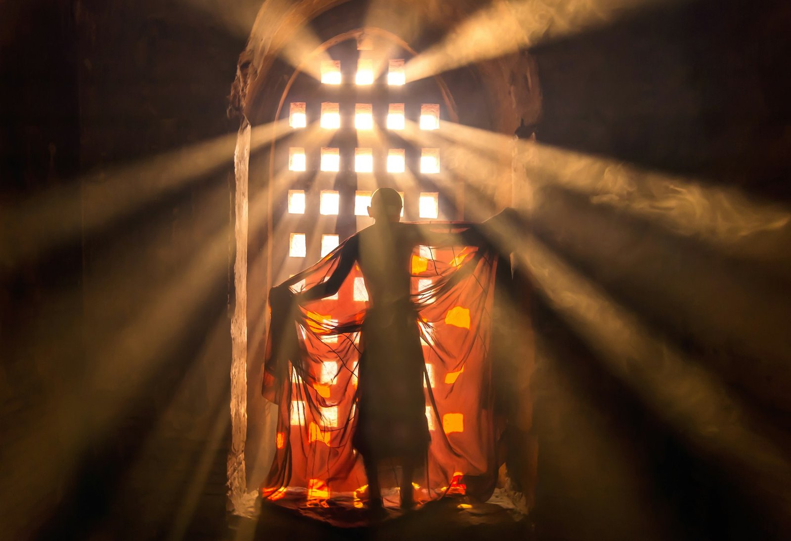 Back side of monk change the robe with sun ray in pagoda at bagan, mandalay, myanmar