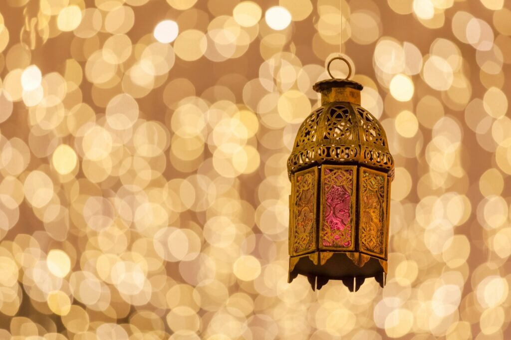 Festive lantern with gold bokeh background. Ramadan Kareem! Eid Mubarak. Islamic holy month.