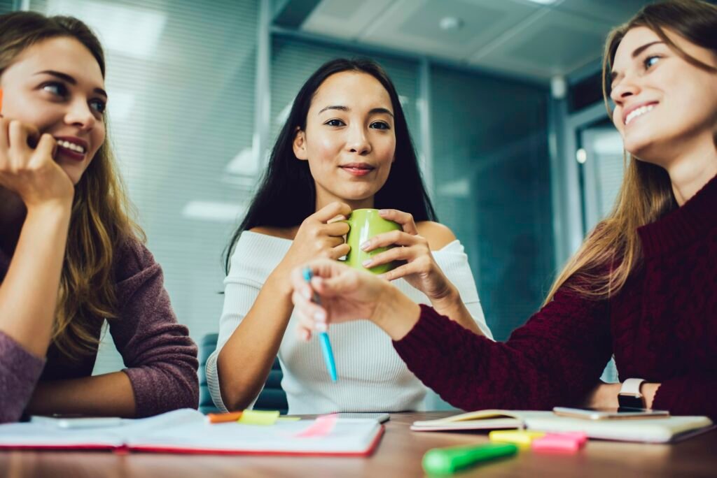 Group of intelligent employees collaborating indoors