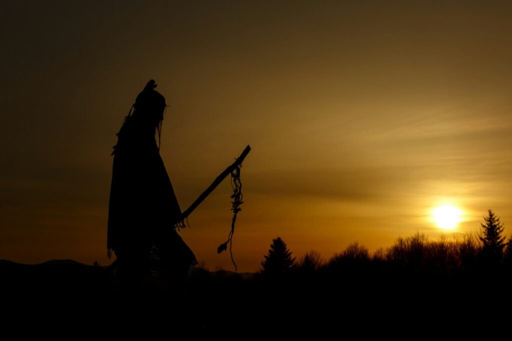 silhouette of native american shaman with pikestaff