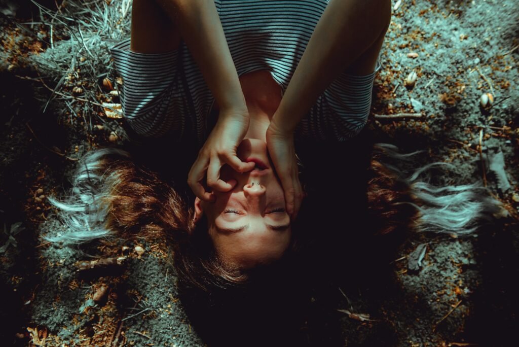 Woman lying on ground