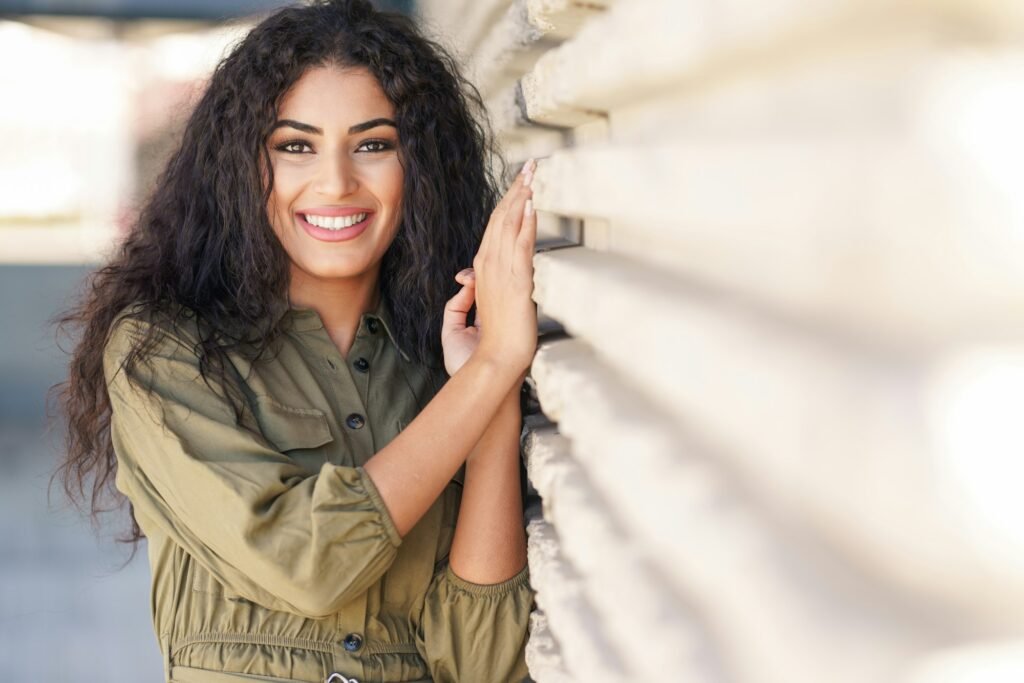 Young Arab Woman with curly hair outdoors