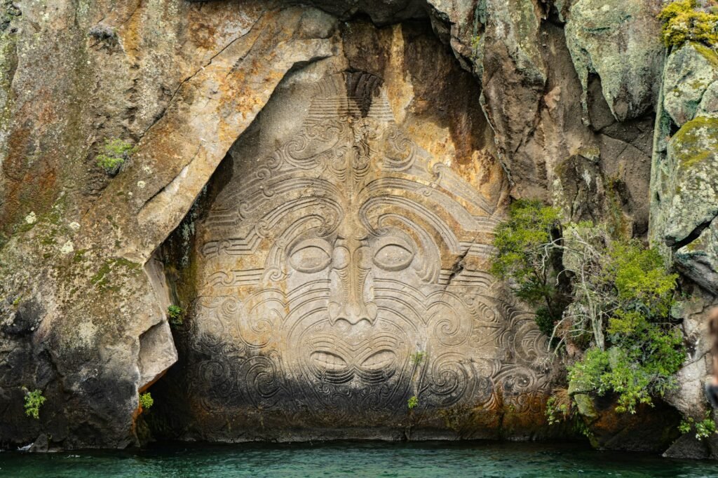 View of Mine Bay Maori Rock Carvings by the water