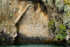 View of Mine Bay Maori Rock Carvings by the water